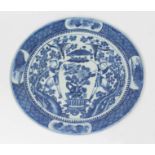 A Chinese blue and white porcelain dish, 19th century, decorated with two men, birds and a vase,