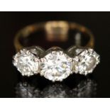 A three stone diamond ring, the round brilliant cut diamonds weighing approx. 0.79, 1.36 & 0.76