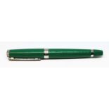 A Rolex green ballpoint pen.
