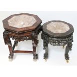 Two Chinese carved hardwood and marble top plant stands, height 45cm & 52cm.