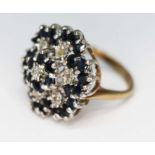 A hallmarked 9ct gold diamond and sapphire cluster ring, the cluster measuring approx. 22mm, gross