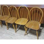 A set of four Ercol blonde elm and beech chairs.