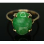 A jadeite jade cabochon ring, marked '9c', gross wt. 2.4g, size O.
