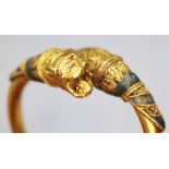 A Western Asiatic lion headed bracelet, circa 5th - 4th century BC, cross over design of round cross