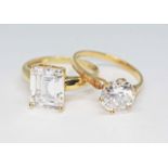 Two hallmarked 14ct gold CZ solitaire rings, gross wt. 6.9g, size R.