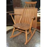 An Ercol light elm and beech rocking chair.