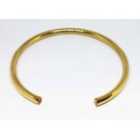 An 18ct gold choker necklace of tubular form, David M Robinson, Sheffield 2000, wt. 31.7g,