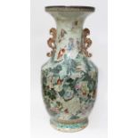 A large Chinese immortals vase, Jiaqing period, twin handled with flared rim and ovoid body,