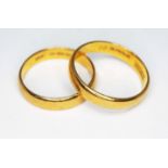 Two hallmarked 22ct gold wedding bands, wt. 8.4g, size P & S.