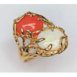 A precious opal and coral cabochon ring, each held within a naturalistically formed setting, cluster