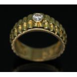 An 18ct gold 'Rolex' design single stone diamond ring, the bezel set round brilliant cut diamond