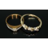 A diamond ring marked '585' and a hallmarked 14ct CZ ring, gross wt. 6.3g, size N & T respectively.