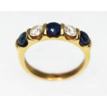 A diamond and sapphire baguette ring, three round cut sapphires weighing approx. 1ct in total,