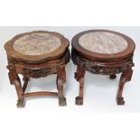 A matched pair of Chinese carved hardwood and marble top plant stands, circa 1900, height 46cm.