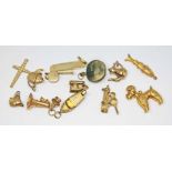 13 hallmarked 9ct gold charms, wt. 20g.