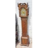 A good quality miniature long case clock, three train movement striking on eight gongs, brass and