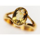 An antique solitaire ring, the oval cut citrine weighing approx. 2ct, band unmarked, gross wt. 6.6g,