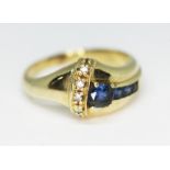 A diamond and sapphire cluster ring, marked '585', gross wt. 6.2g, size R/S.