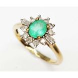 A hallmarked 9ct gold diamond and emerald cluster ring, gross wt. 2.1g, size M.