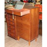 An Avalon mid 20th century teak tallboy chest of drawers with fold out mirror to top drawer,