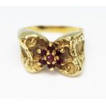 A ruby cluster ring, band unmarked, probably 9ct, gross wt. 6.8g, size K.