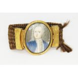 A gilt metal plaited hair and miniature portrait brooch circa 1800, the oval portrait measuring