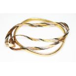 A three colour chain marked '375' and a bangle with 9ct gold import marks, wt. 12.7g.
