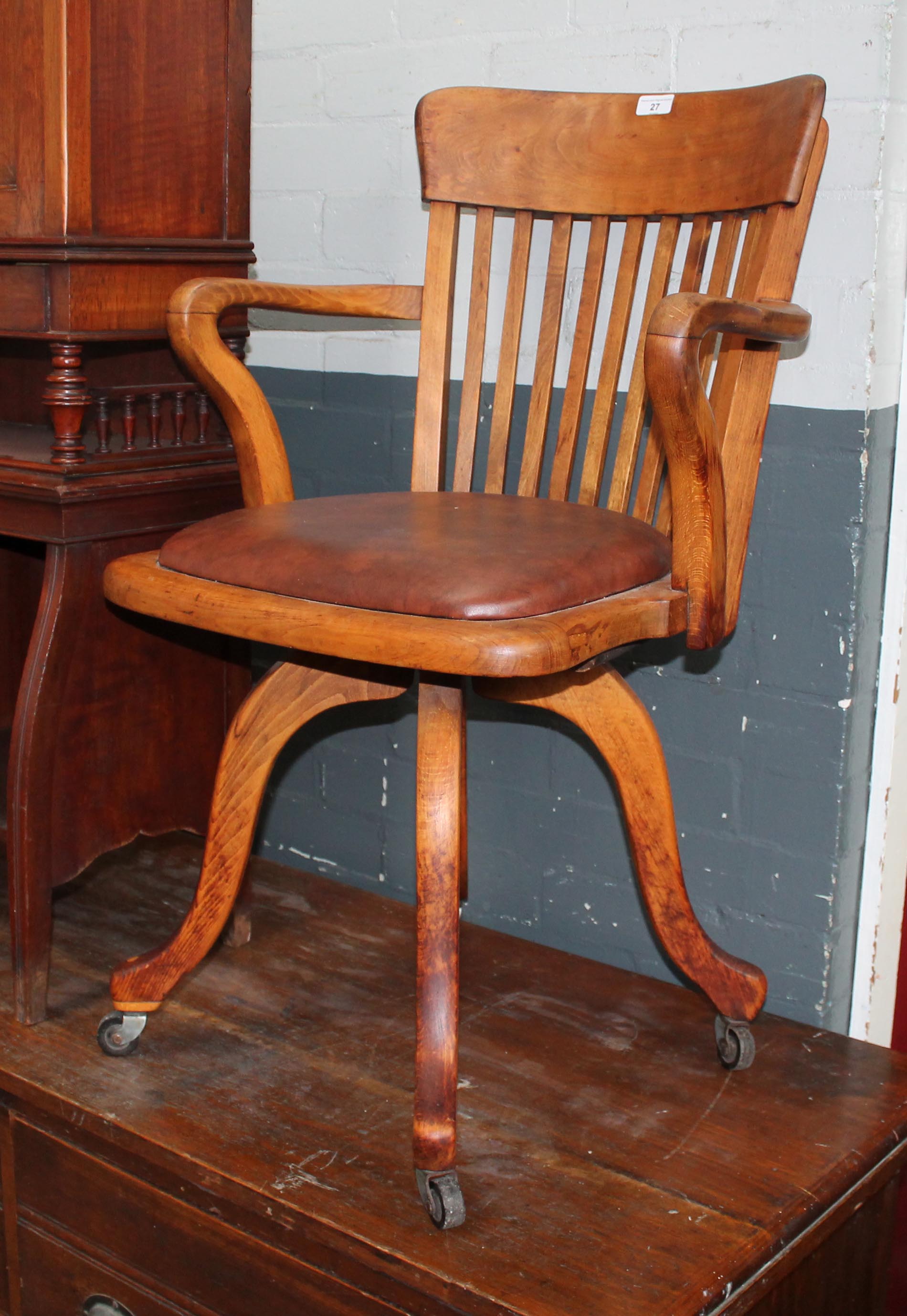 A 20th century beech captain's chair.