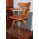 A 20th century beech captain's chair.