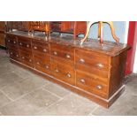 A large early 20th century oak shop counter, originally from a millinery shop in Crosby, height 90.