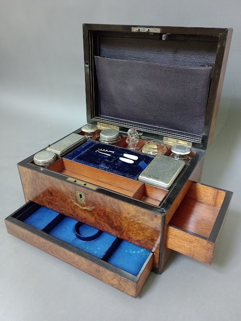 A 19th century burr walnut work box with fitted interior, containing a number of cut glass and