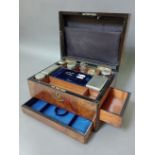 A 19th century burr walnut work box with fitted interior, containing a number of cut glass and