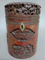A 19th century Chinese carved bamboo tea caddy with brass lock, height 17cm.