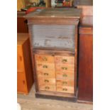 An early 20th century oak tambour fronted filing cabinet/ chest of drawers, height 115.5cm.