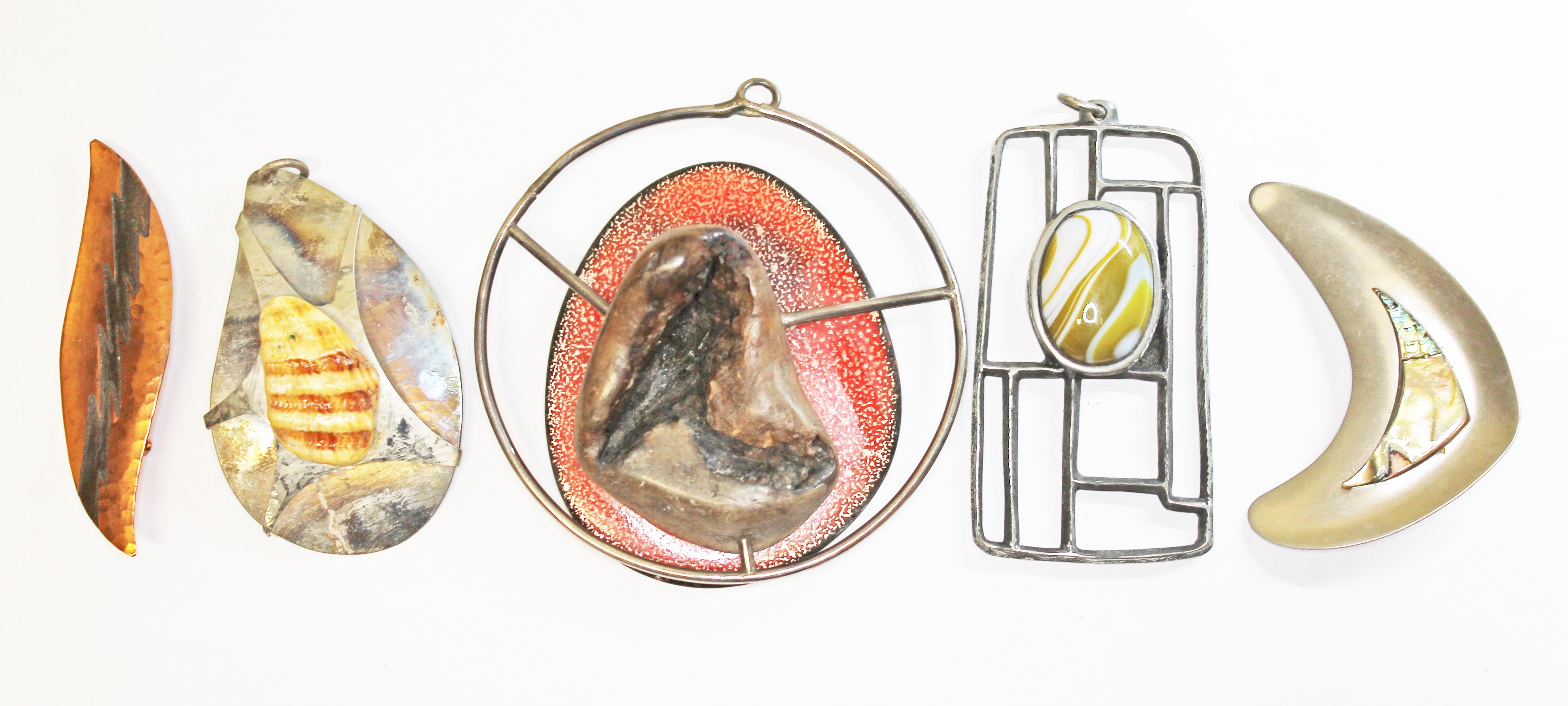 A group of five modernist brooches.