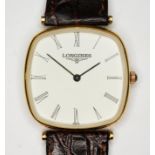 A man's gold plated Longines wristwatch, white dial with Roman numerals, Longines leather strap.