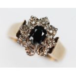 A hallmarked 9ct gold diamond and sapphire cluster ring, the cluster measuring approx. 11.75mm x