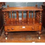 A Victorian walnut Canterbury with twist supports.