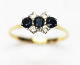 A hallmarked 18ct gold sapphire and diamond cluster ring, gross wt. 2.3g, size M.