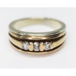 A hallmarked 9ct gold three stone diamond ring, gross wt. 9.6g, size U.