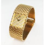 A gold plated Raymond Wiel wristwatch with checker board dial and gold plated basket weave