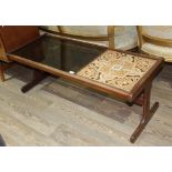 A mid 20th century G Plan teak tile and smoked glass top coffee table, length 121cm.