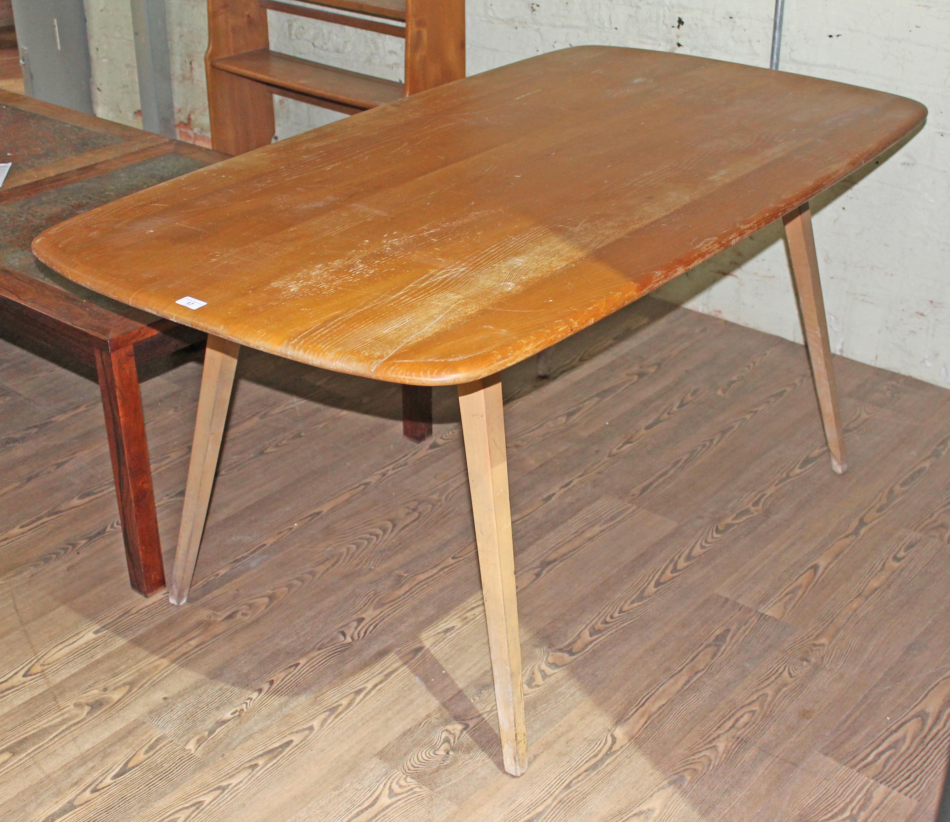 An Ercol light elm 'Plank' table, height 71cm, length 153 and width 83cm.