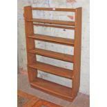 A vintage Ercol light elm open bookcase, height 133cm and width 82.5cm.