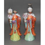 A pair of Chinese over enamelled porcelain figures, late 18th/early 19th century, height 29cm, as