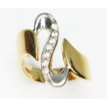 A two colour ring set with colourless stones, marked '585', gross wt. 5.7g, size O/P.