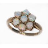 A hallmarked 9ct gold opal cluster ring, the five opal cabochons arrange in a flower shap