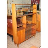 A retro teak room divide bookcase, height 167cm, width 122cm.