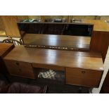 A G-Plan teak dressing table with brass ring pull handles, length 160cm.