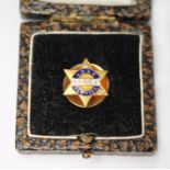 A diamond set AAOC long service badge, the screw back marked '9ct', gross wt. 2.5g, with box.